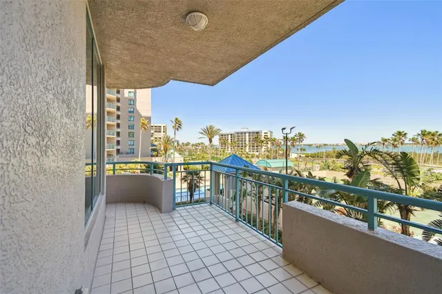 a view of swimming pool with outdoor seating and city view