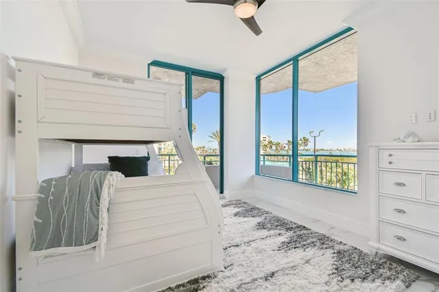 a view of a patio with table and chairs and potted plants