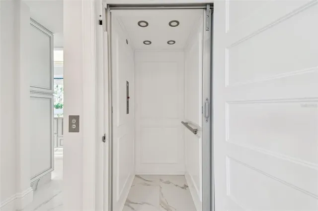 a view of swimming pool with outdoor seating