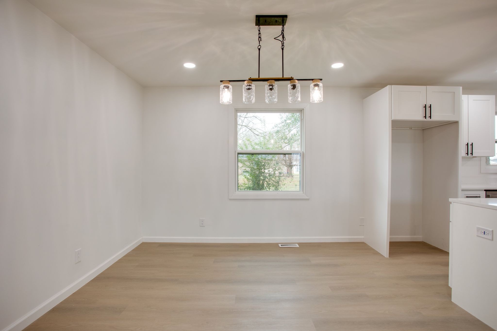 223 Hampton Road Columbia, TN 38401 - Photo 16 of 38 an empty room with a kitchen and a window