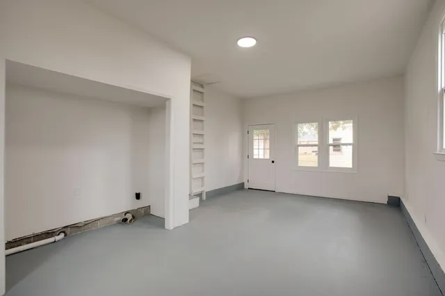 an empty room with windows