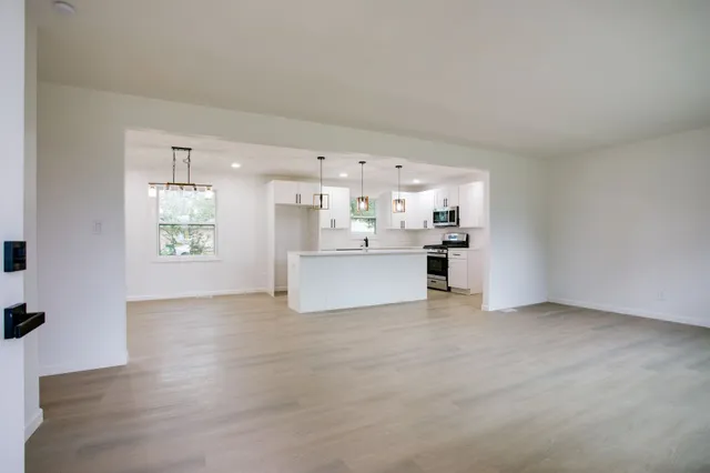 a view of a kitchen with a sink cabinets and a dishwasher