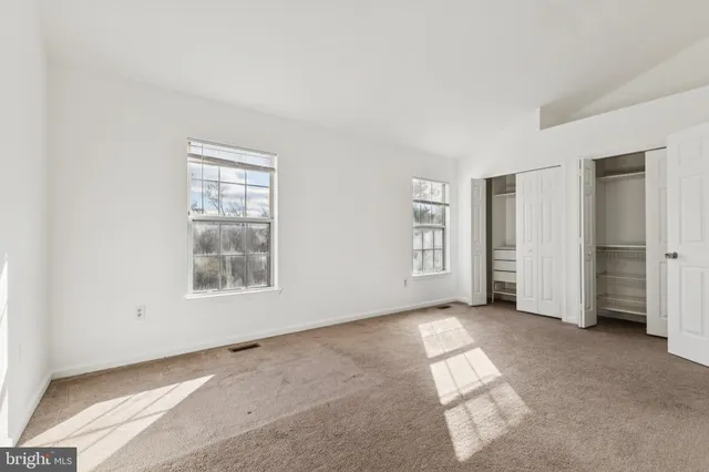 an empty room with windows