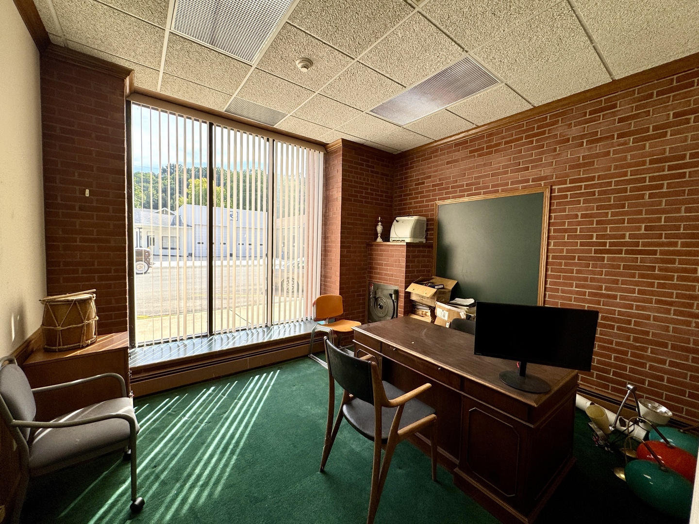 100 West Main Street Tiskilwa, IL 61368 - Photo 12 of 27 a living room with furniture and a flat screen tv
