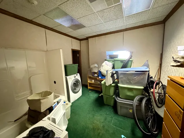 a bedroom with furniture and a chair