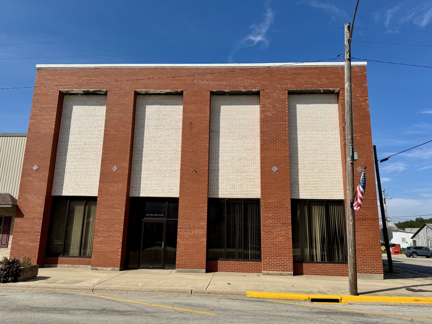 100 West Main Street Tiskilwa, IL 61368 - Photo 2 of 27 a view of a brick house with a large windows