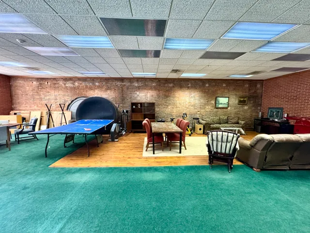 a living room with furniture and a pool
