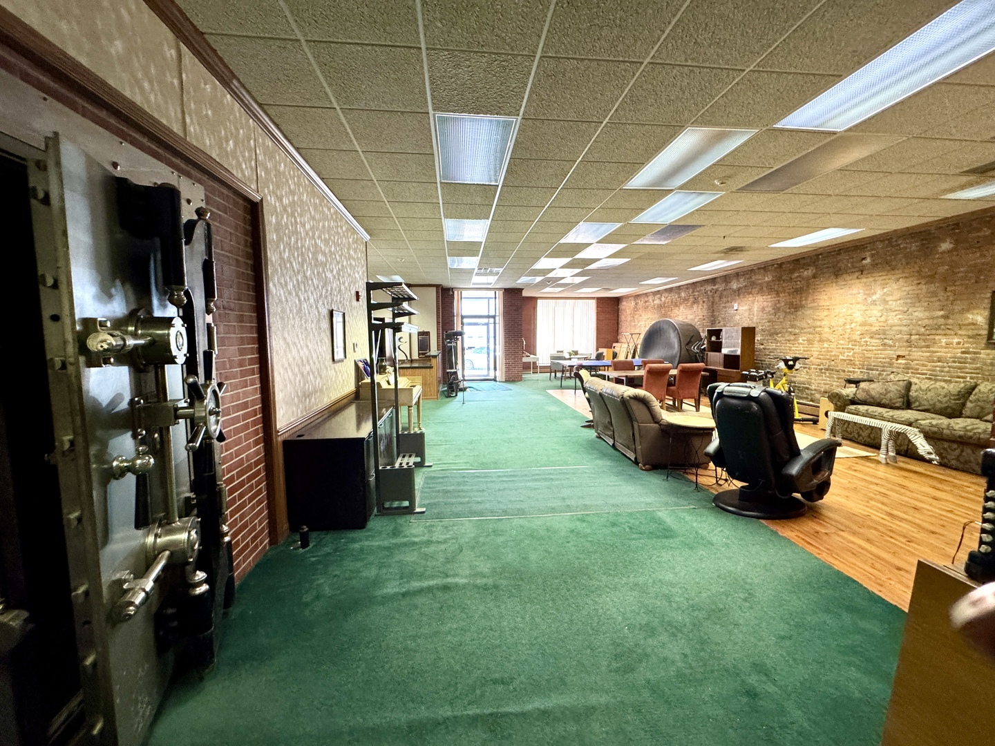 100 West Main Street Tiskilwa, IL 61368 - Photo 8 of 27 a living room with lots of furniture and a kitchen view