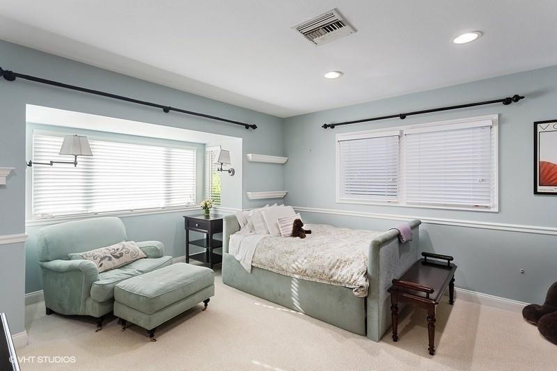 10 Saranac Road Sea Ranch Lakes, FL 33308 - Photo 14 of 26 a bedroom with furniture and a window