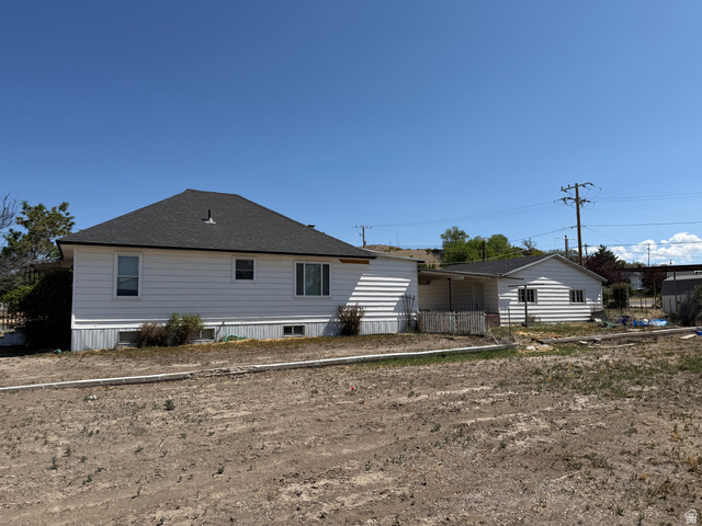 196 North 5th West Price, UT 84501 - Photo 26 of 27 White siding residence with a dark shingle roof