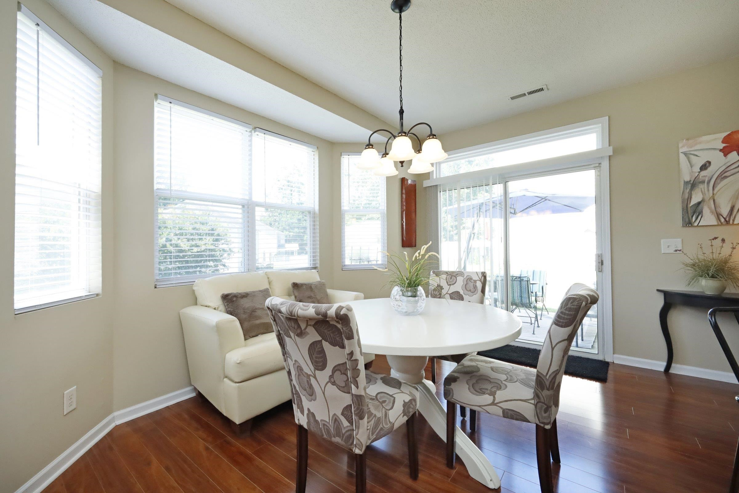 2439 Quarry Ridge Lane Raleigh, NC 27610 - Photo 17 of 41 a view of a dining room with furniture wooden floor and chandelier