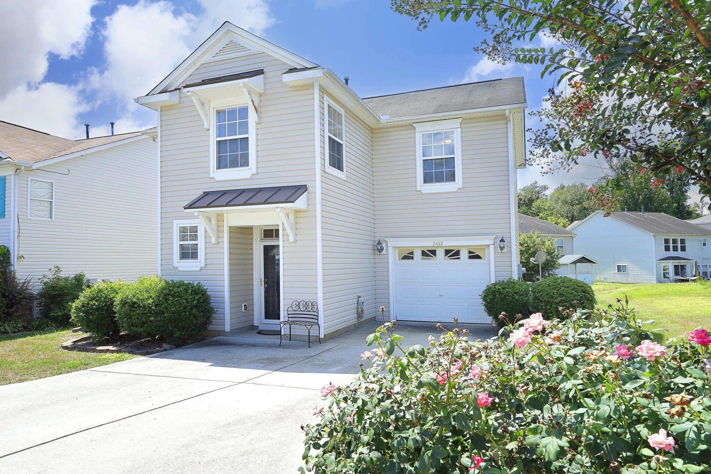 2439 Quarry Ridge Lane Raleigh, NC 27610 - Photo 2 of 41 a front view of a house with garden