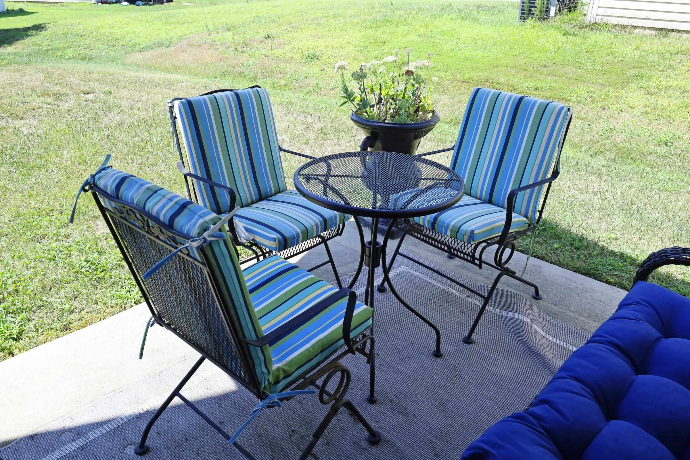 2439 Quarry Ridge Lane Raleigh, NC 27610 - Photo 36 of 41 a view of a chairs and table in patio with a yard