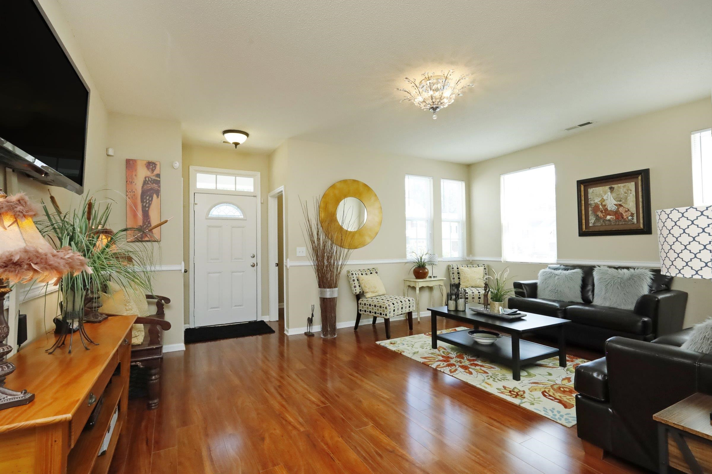 2439 Quarry Ridge Lane Raleigh, NC 27610 - Photo 4 of 41 a living room with fireplace furniture and a flat screen tv