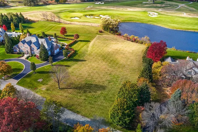 a view of a swimming pool with an outdoor space and seating area