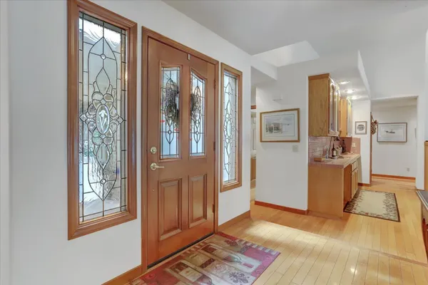 a view of a dining room with furniture wooden floor and chandelier