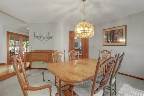 a kitchen with a stove a sink a counter space and dining table