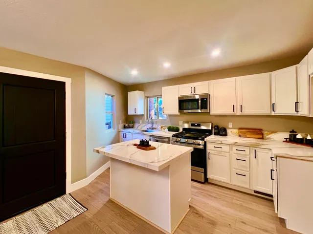 a bathroom with a sink mirror and toilet