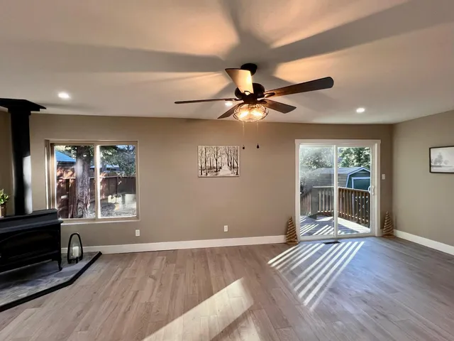 a kitchen with sink stove and cabinets