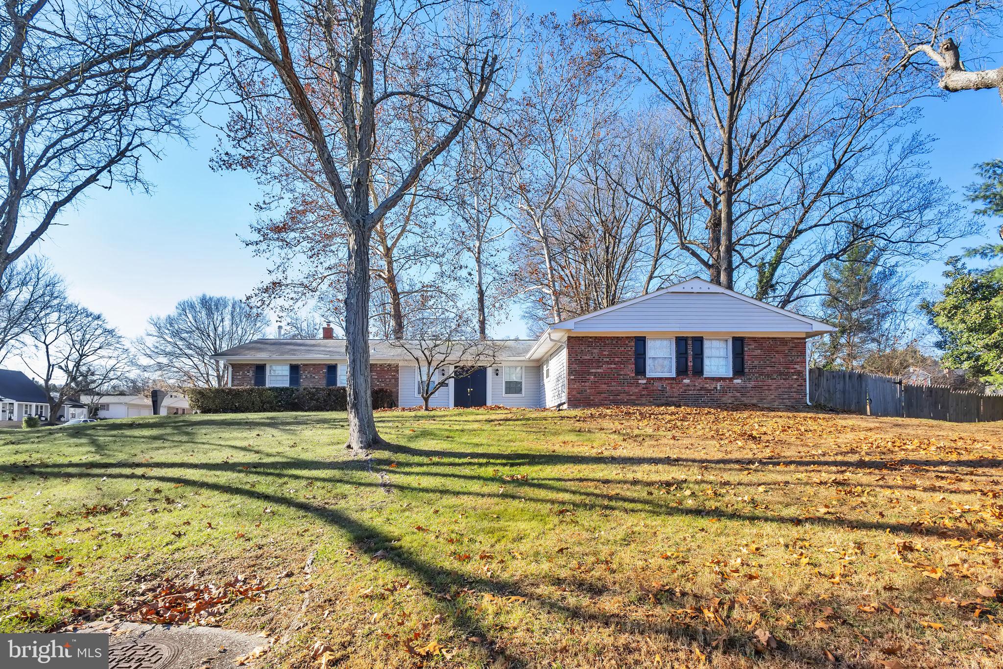 a view of a house with a large trees