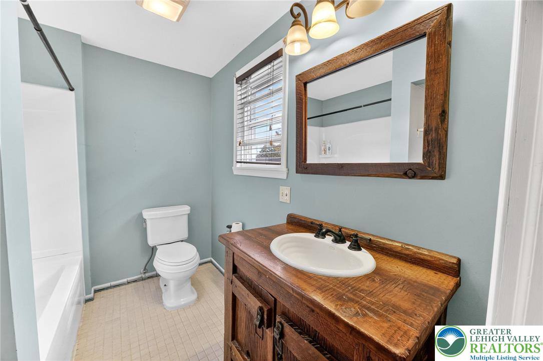 202 Main Street Portland, PA 18343 - Photo 19 of 40 a bathroom with a sink toilet and mirror