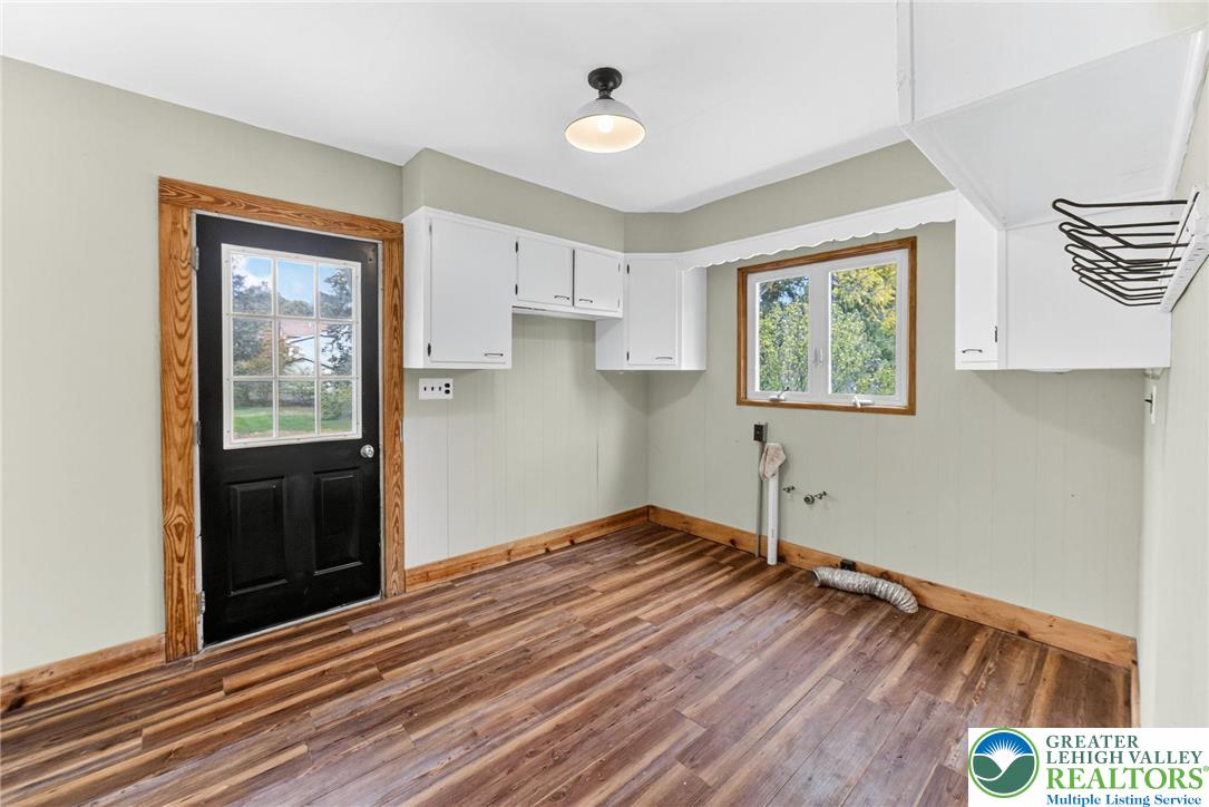 202 Main Street Portland, PA 18343 - Photo 26 of 40 a view of an empty room with wooden floor and a window