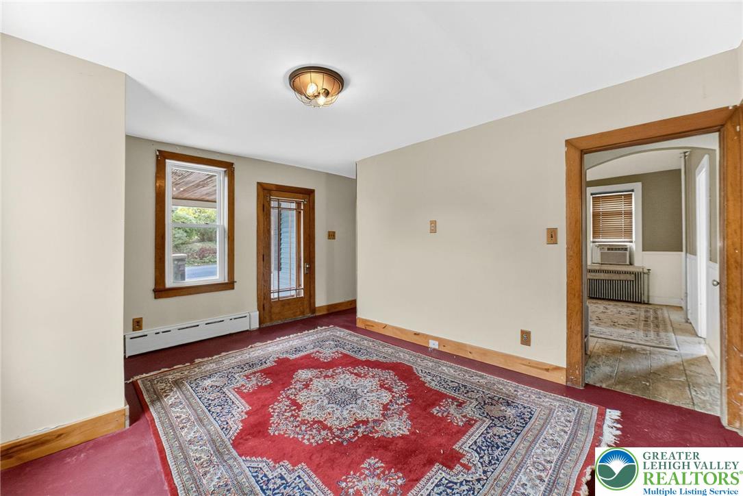 202 Main Street Portland, PA 18343 - Photo 27 of 40 a view of an empty room with window and wooden floor