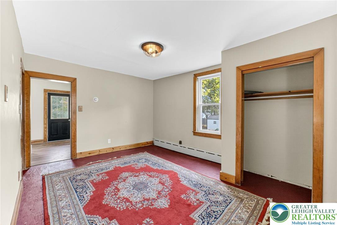202 Main Street Portland, PA 18343 - Photo 28 of 40 a view of an empty room with window and wooden floor
