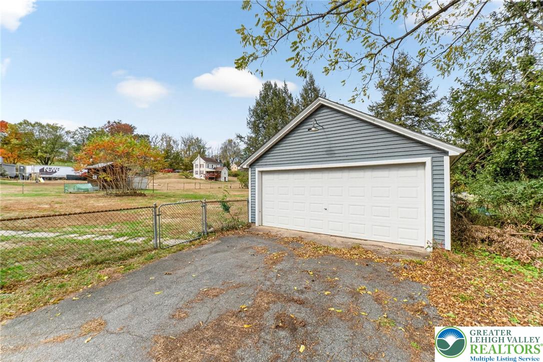 202 Main Street Portland, PA 18343 - Photo 10 of 40 a view of a house with a yard and garage