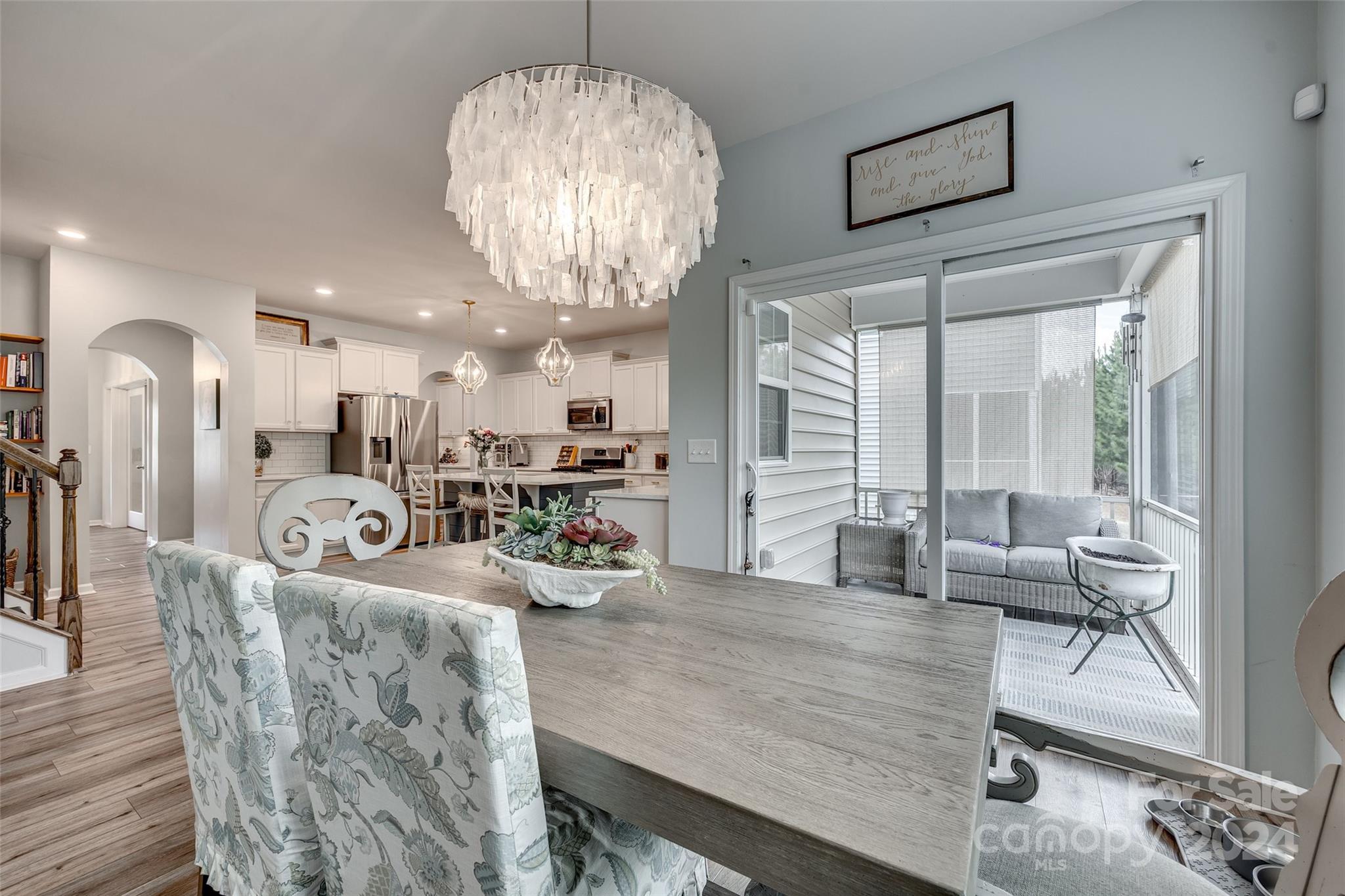 2251 Elmview Lane Fort Mill, SC 29715 - Photo 11 of 46 a room with lots of white furniture and chandelier