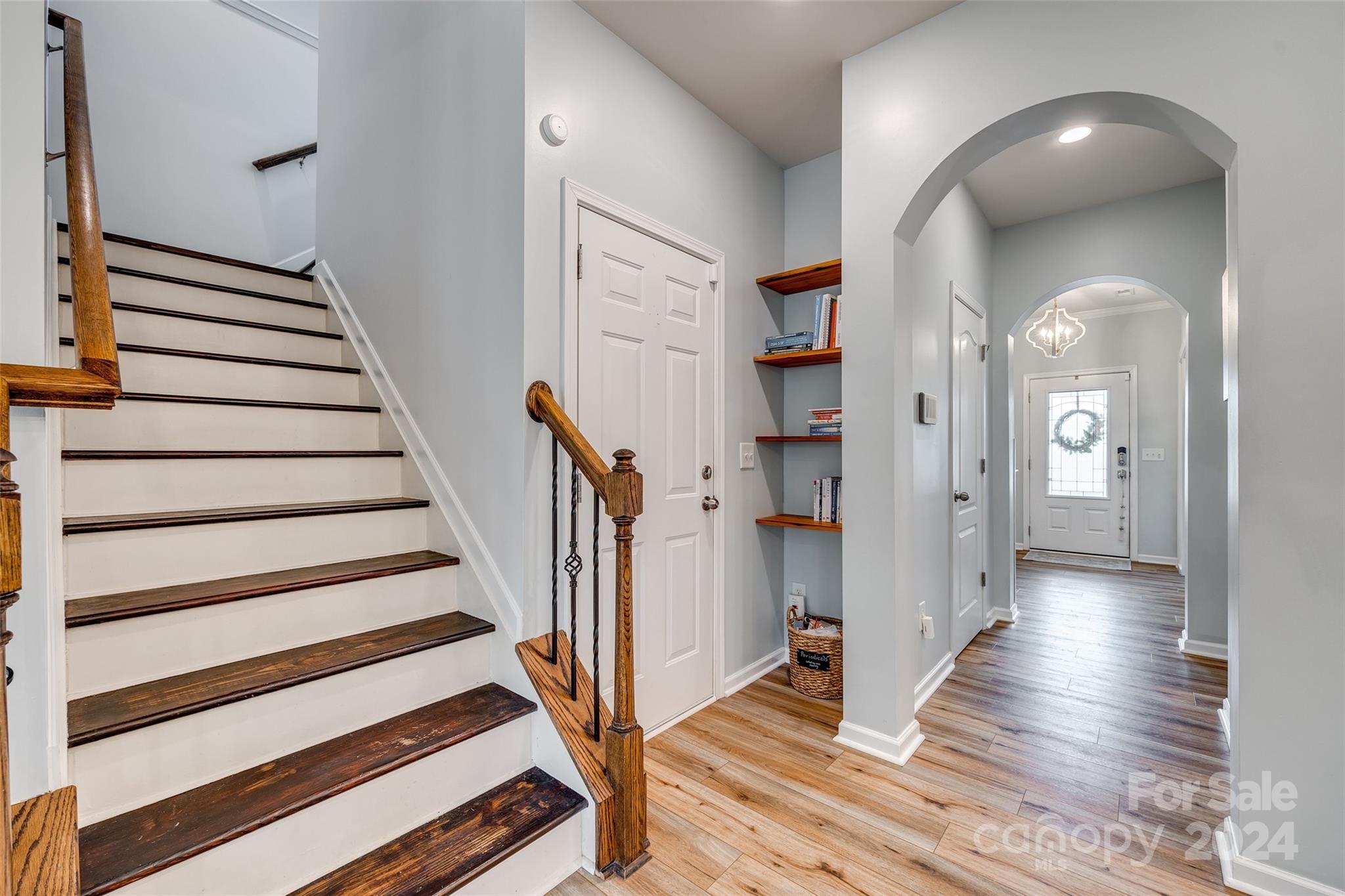 2251 Elmview Lane Fort Mill, SC 29715 - Photo 16 of 46 a view of a hallway with wooden floor and entryway