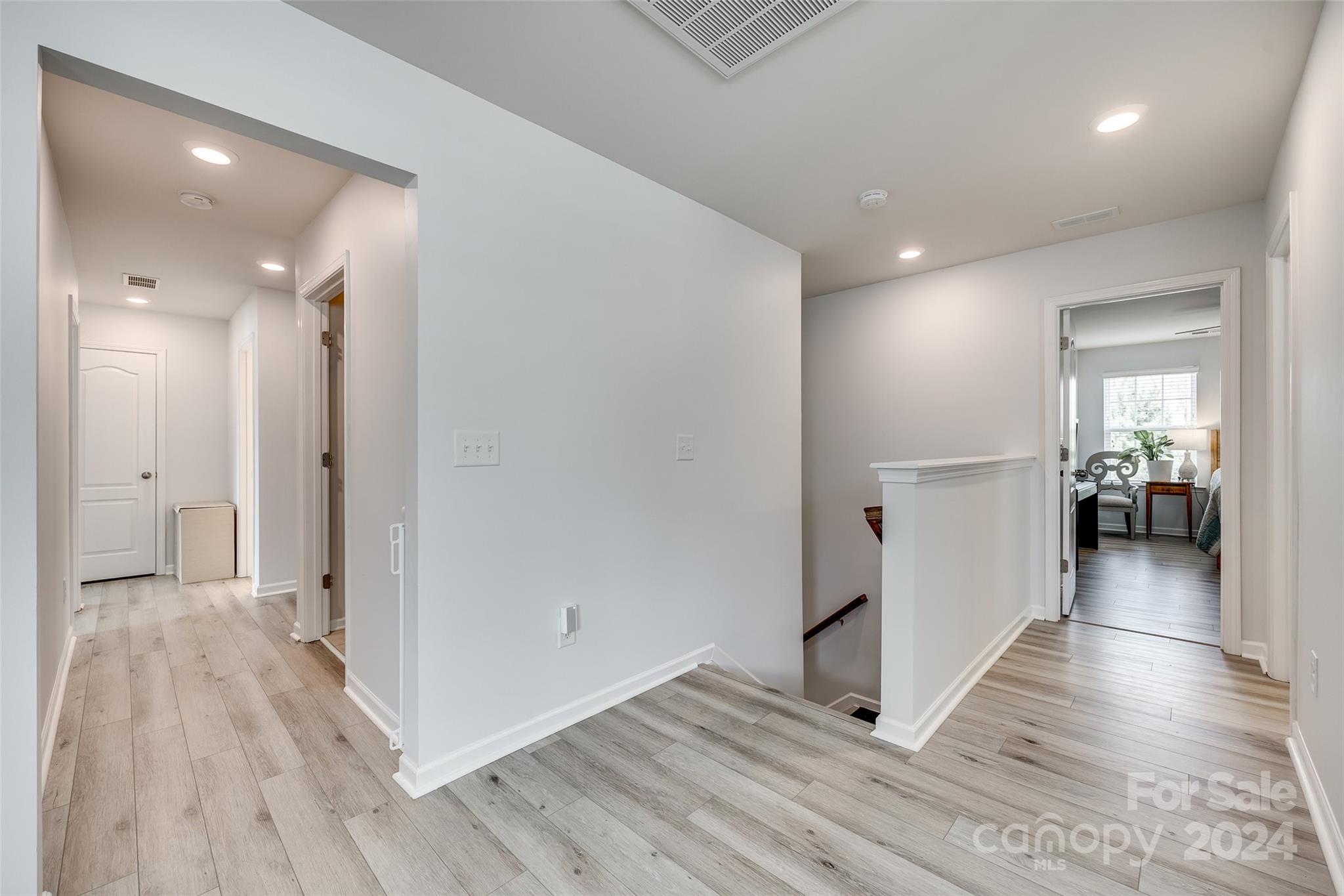 2251 Elmview Lane Fort Mill, SC 29715 - Photo 18 of 46 a view of a hallway view with wooden floor and a bathroom