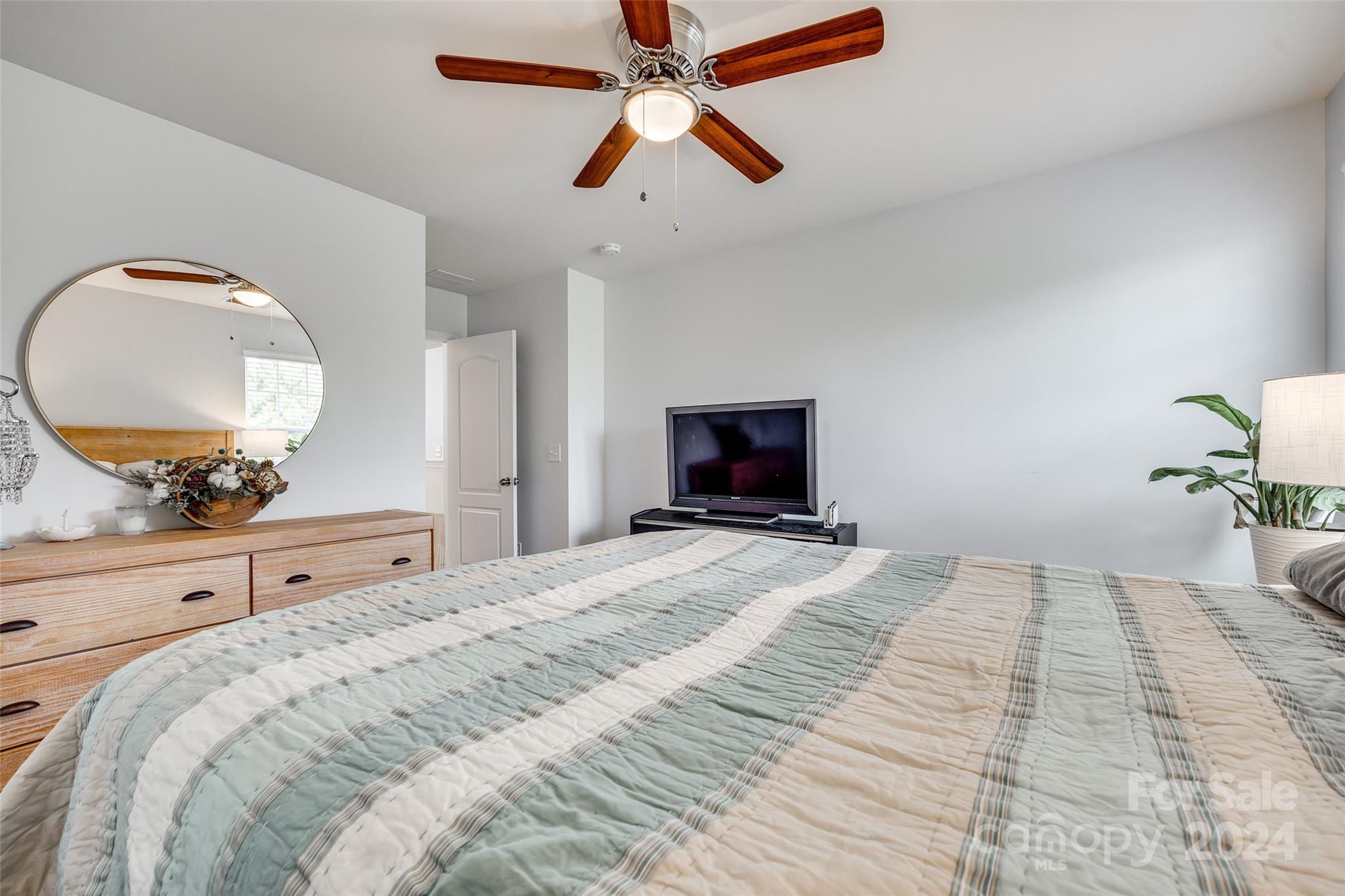 2251 Elmview Lane Fort Mill, SC 29715 - Photo 20 of 46 a bedroom with a bed and a large mirror