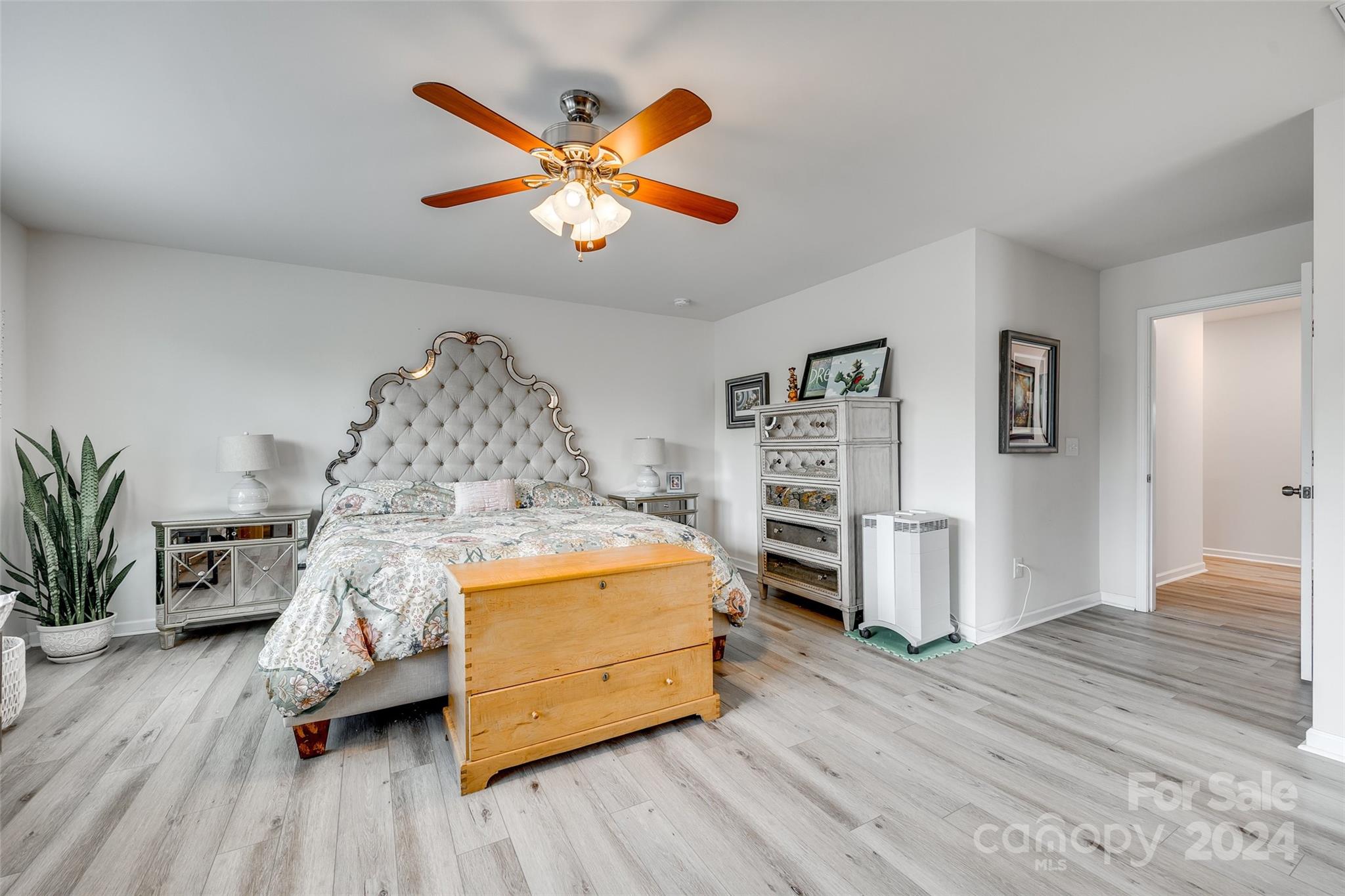2251 Elmview Lane Fort Mill, SC 29715 - Photo 27 of 46 a bed room with a bed and a chandelier