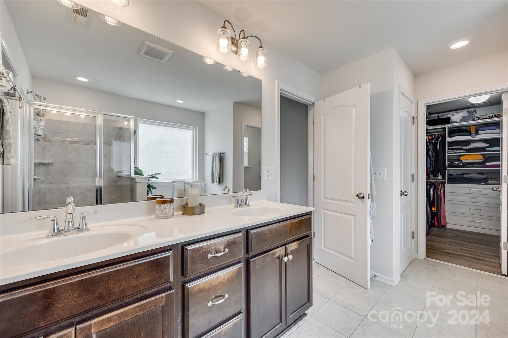2251 Elmview Lane Fort Mill, SC 29715 - Photo 30 of 46 a bathroom with a sink double vanity and a mirror