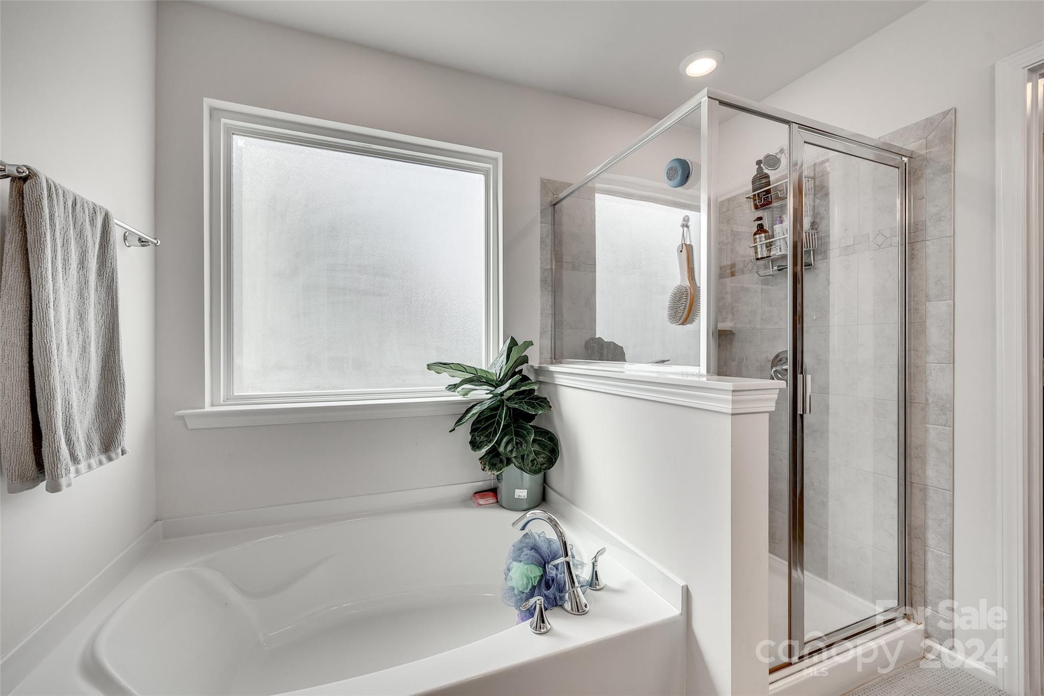 2251 Elmview Lane Fort Mill, SC 29715 - Photo 31 of 46 a bath room with a bathtub and a shower