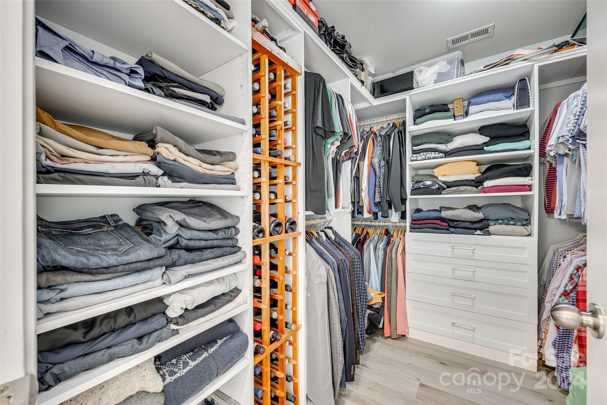2251 Elmview Lane Fort Mill, SC 29715 - Photo 32 of 46 a view of walk in closet with clothes and shoes