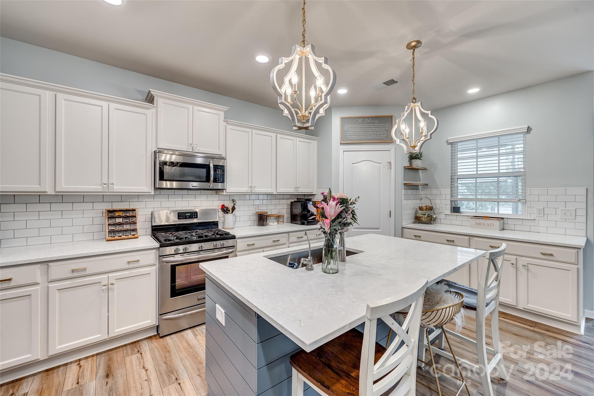 2251 Elmview Lane Fort Mill, SC 29715 - Photo 7 of 46 a kitchen with sink a microwave and cabinets