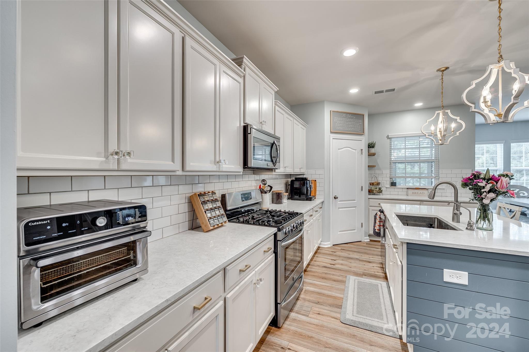 2251 Elmview Lane Fort Mill, SC 29715 - Photo 9 of 46 a kitchen with stainless steel appliances granite countertop a stove a sink and cabinets