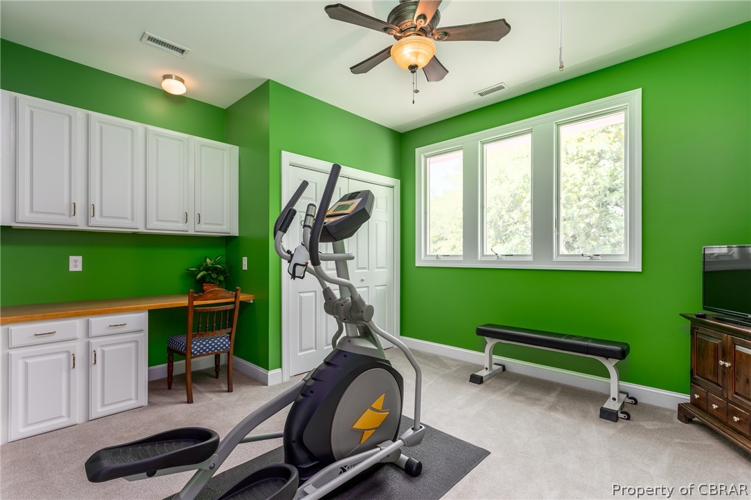 901 Oak Hill Road Lancaster, VA 22503 - Photo 39 of 49 a room with gym equipment and windows