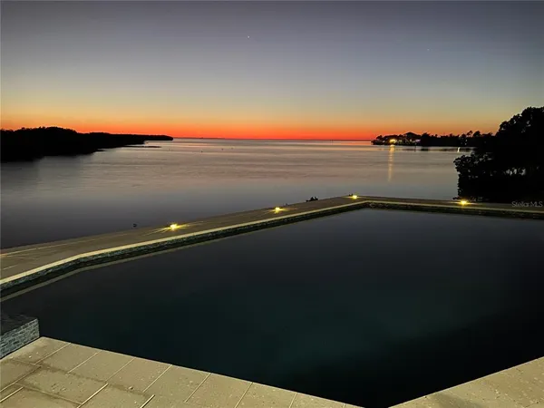 a view of an ocean beach and mountain