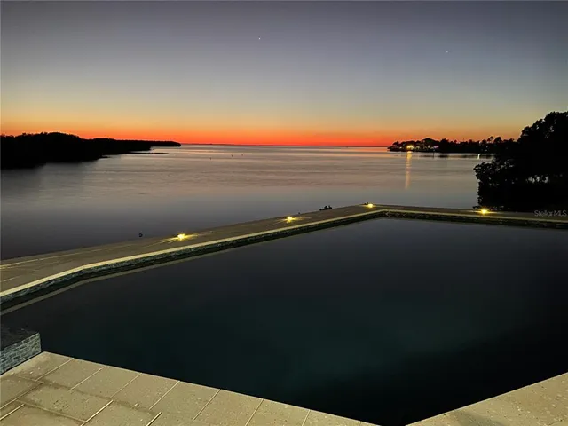 a view of an ocean beach and mountain