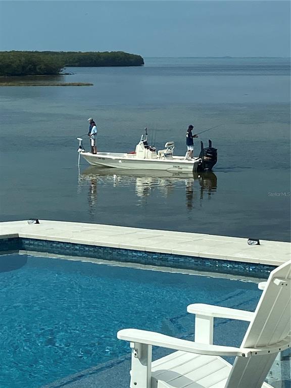 3840 Rudder Way New Port Richey, FL 34652 - Photo 16 of 18 a view of table and chair
