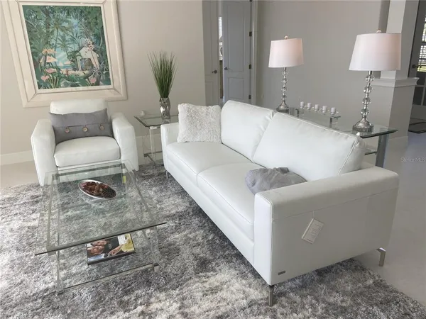 a living room with a couch and a table