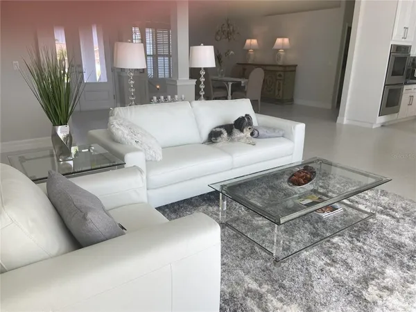 a living room with furniture and a table