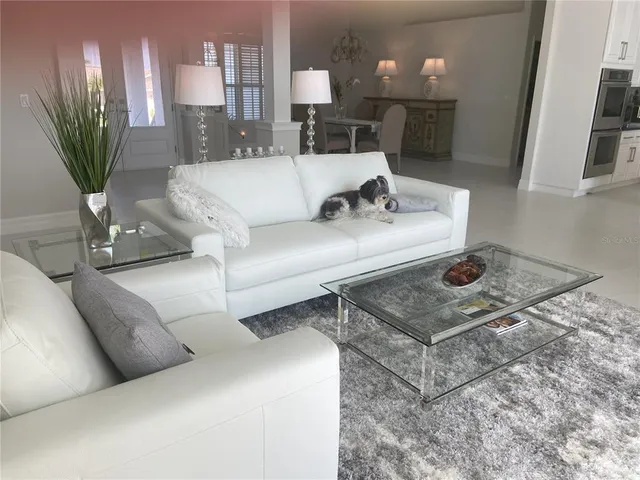 a living room with furniture and a table