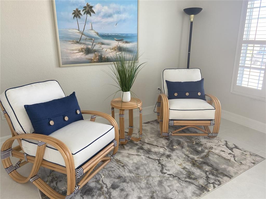 3840 Rudder Way New Port Richey, FL 34652 - Photo 5 of 18 a bedroom with a bed and a chandelier