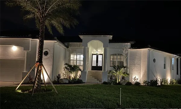a front view of a house with garden