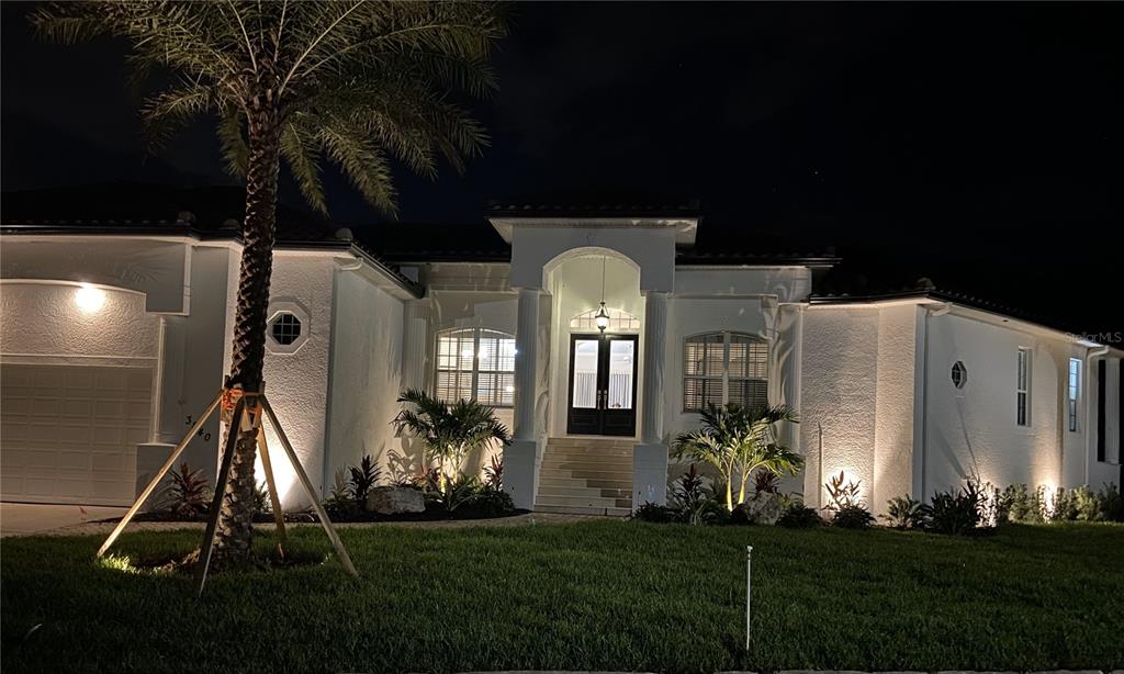 3840 Rudder Way New Port Richey, FL 34652 - Photo 10 of 18 a front view of a house with garden