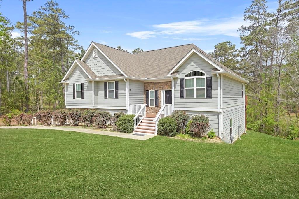 a front view of a house with a yard